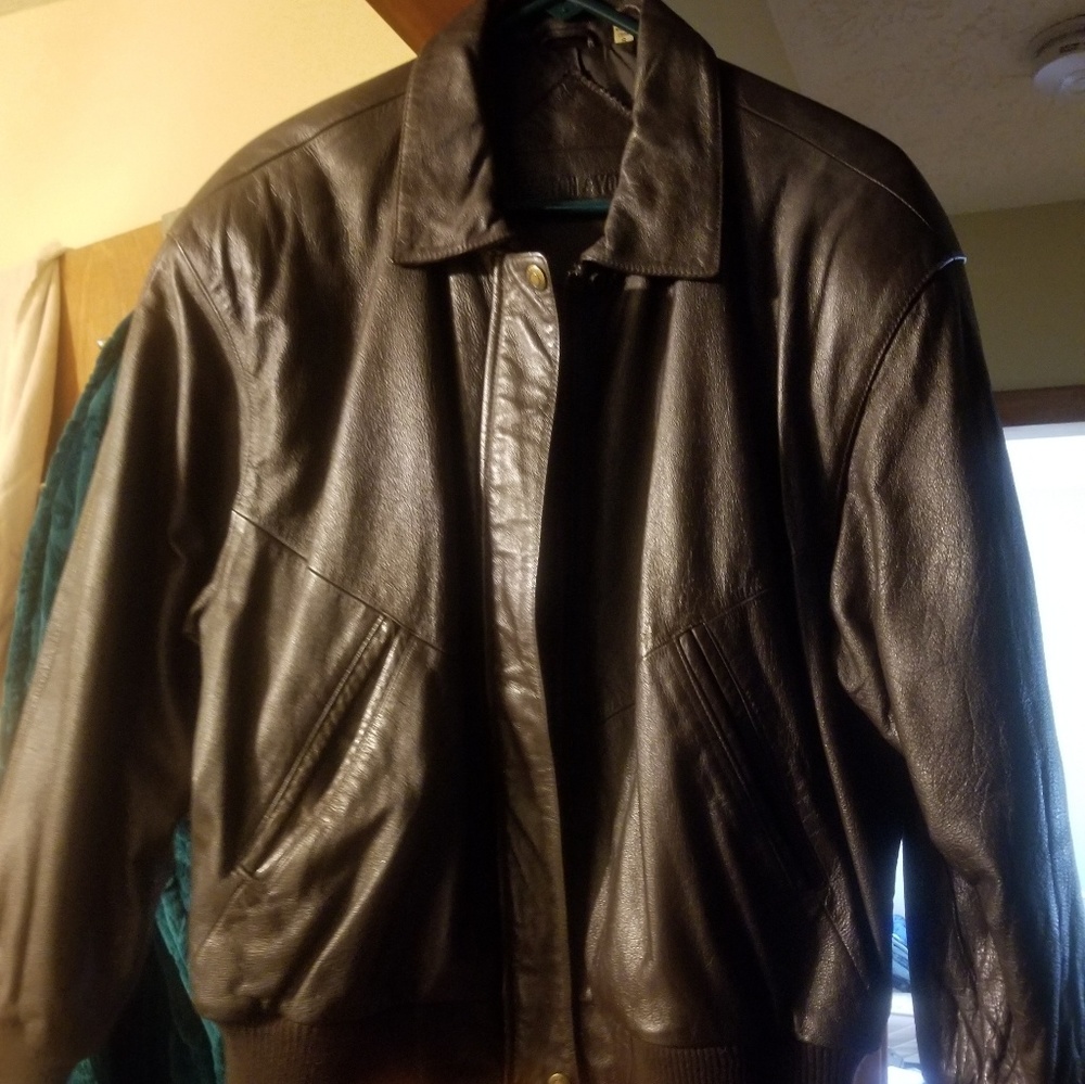 Lady size small brown leather jacket.
